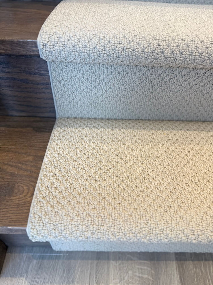DIY Berber stair runner installation on wood stairs