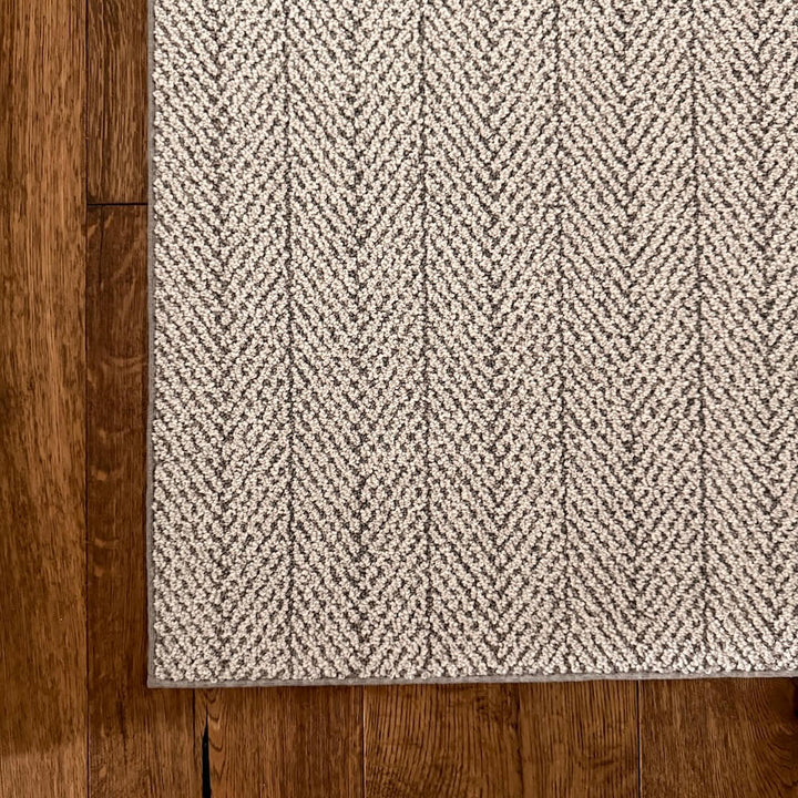 Grey hallway runner on wood planks