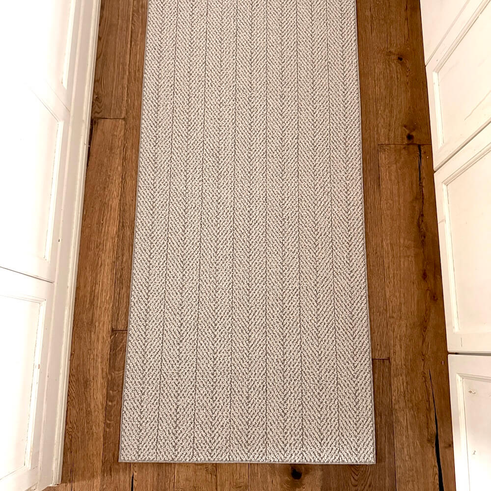 Textured area rug on a wooden floor