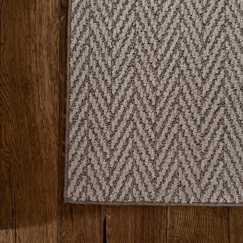 Patterned rug on a wooden floor