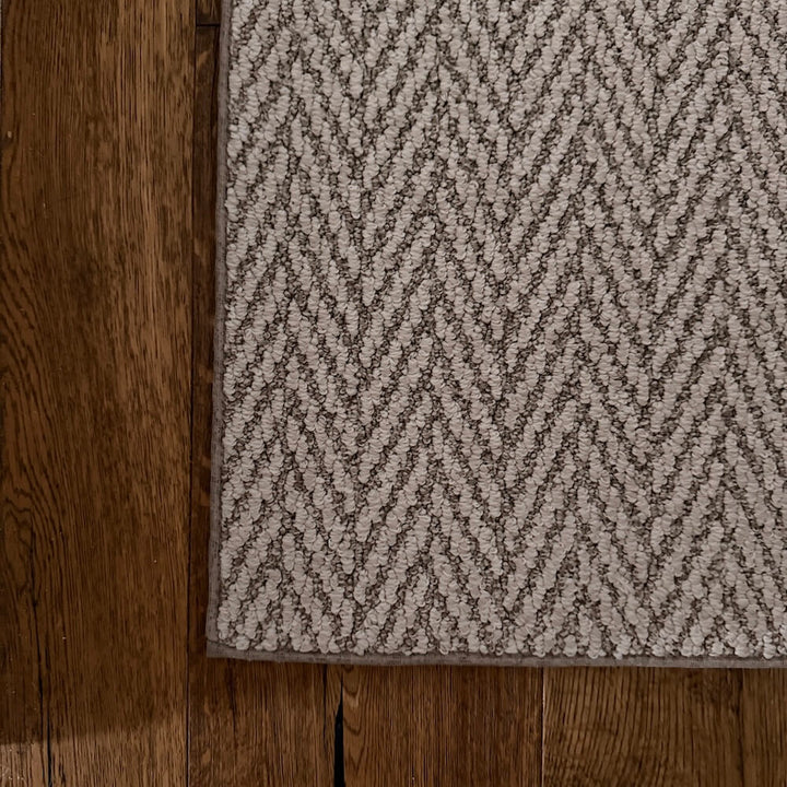 Patterned rug on a wooden floor