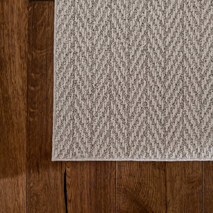 Textured rug on a wooden floor