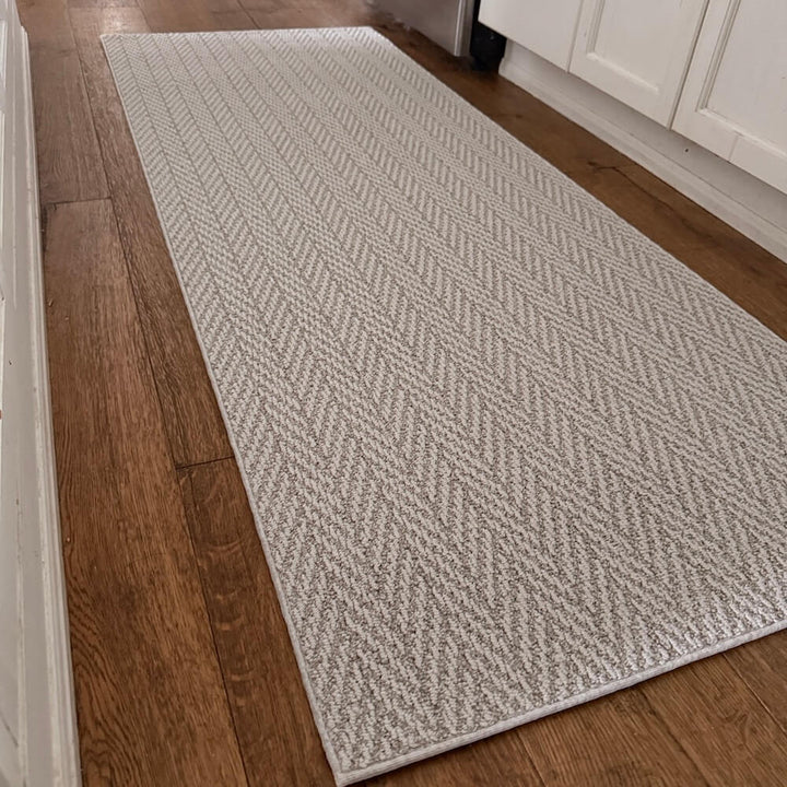Gray patterned rug on a wooden floor