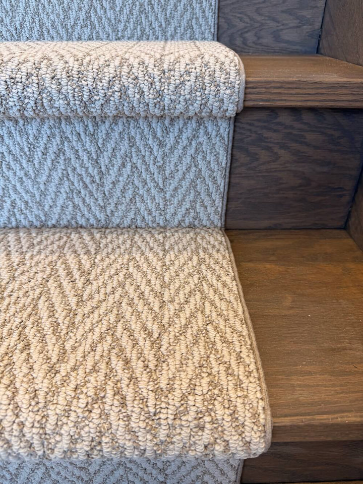 Textured blue and beige stair runner on wooden stairs
