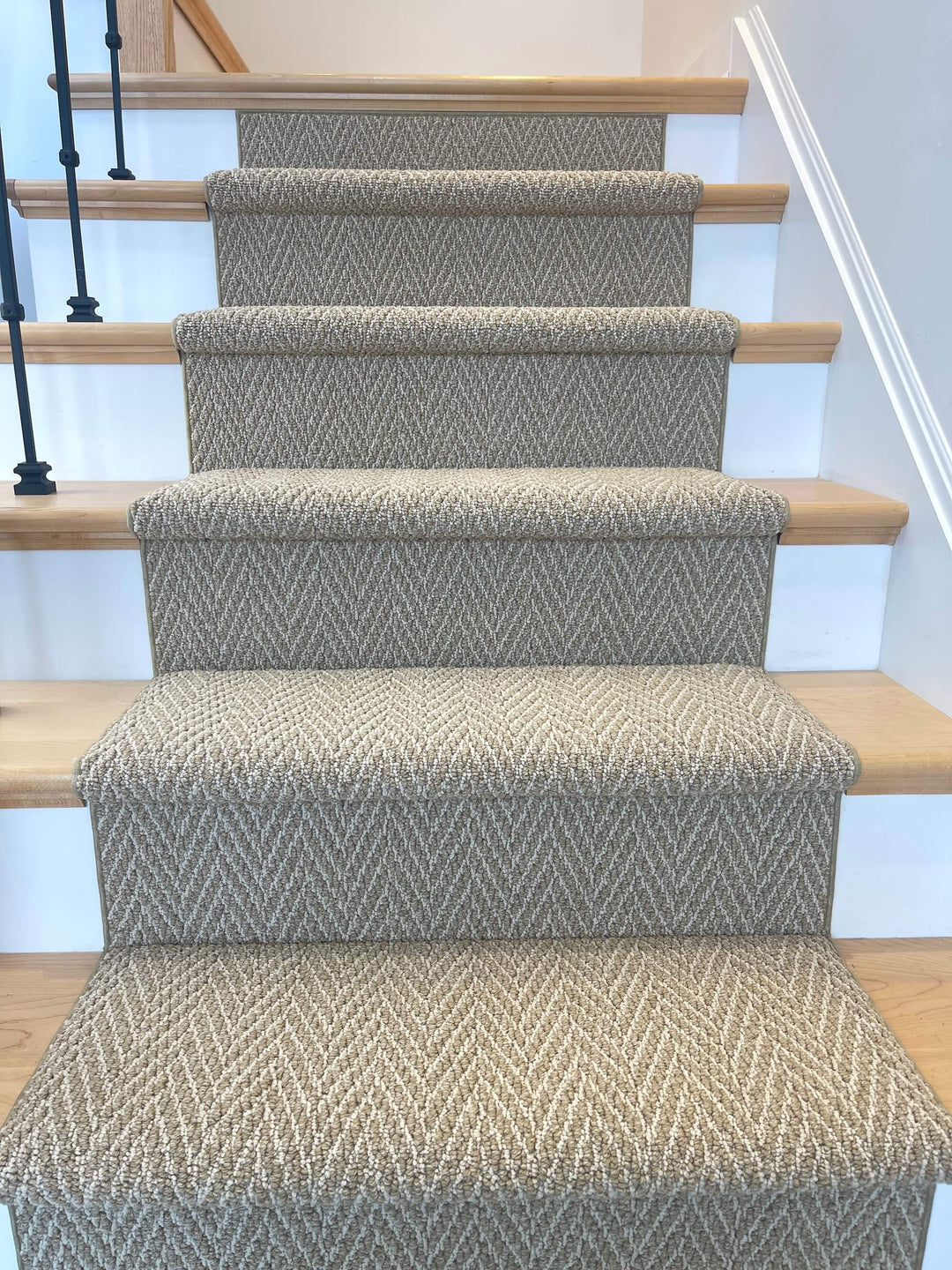 front looking view of gold herringbone stair runner