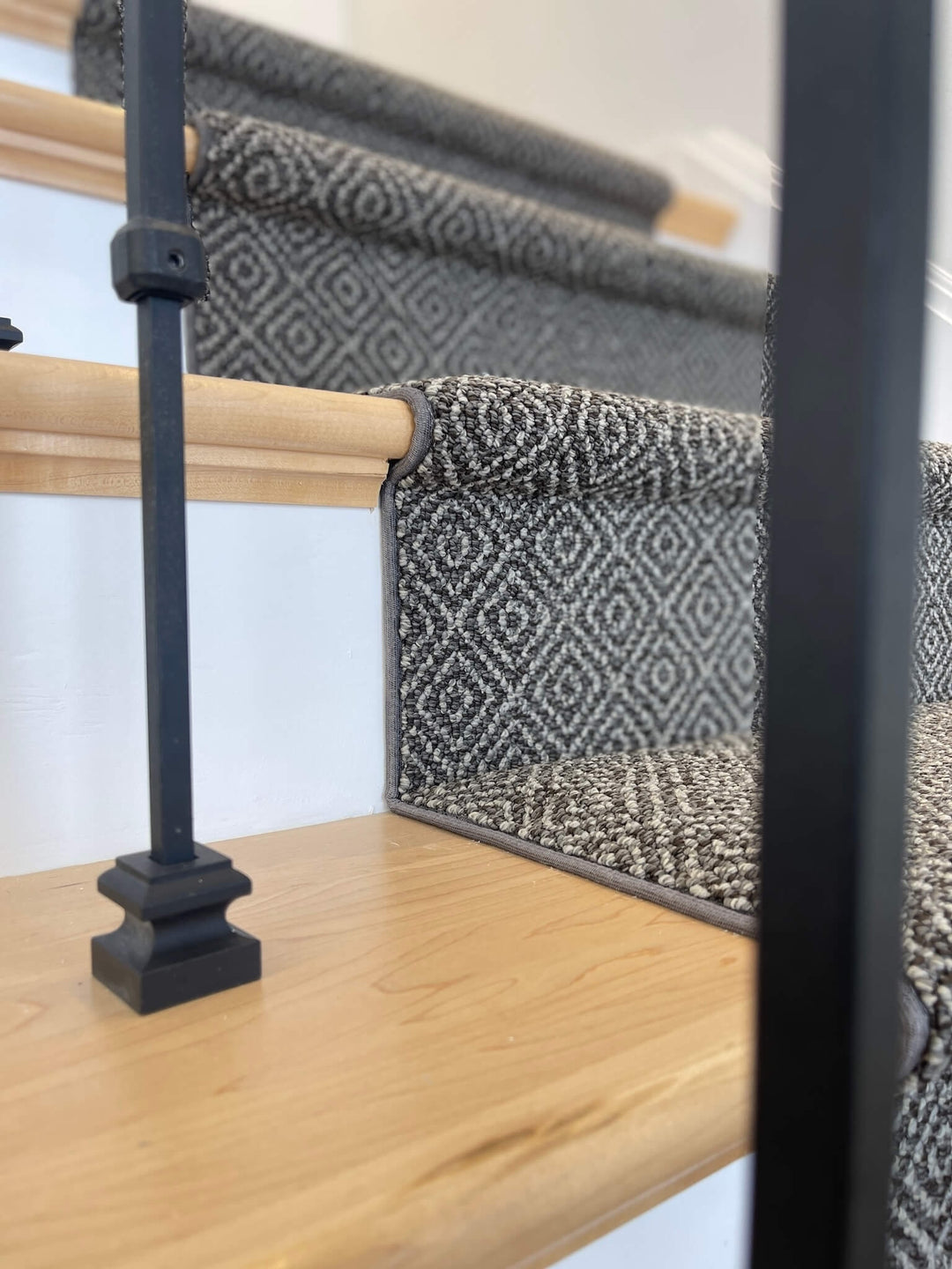 side view of a dark nylon stair runner