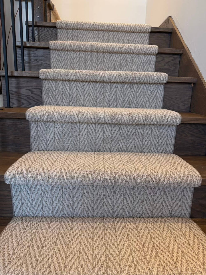 musroom color stair runner with herringbone pattern on wood stairs