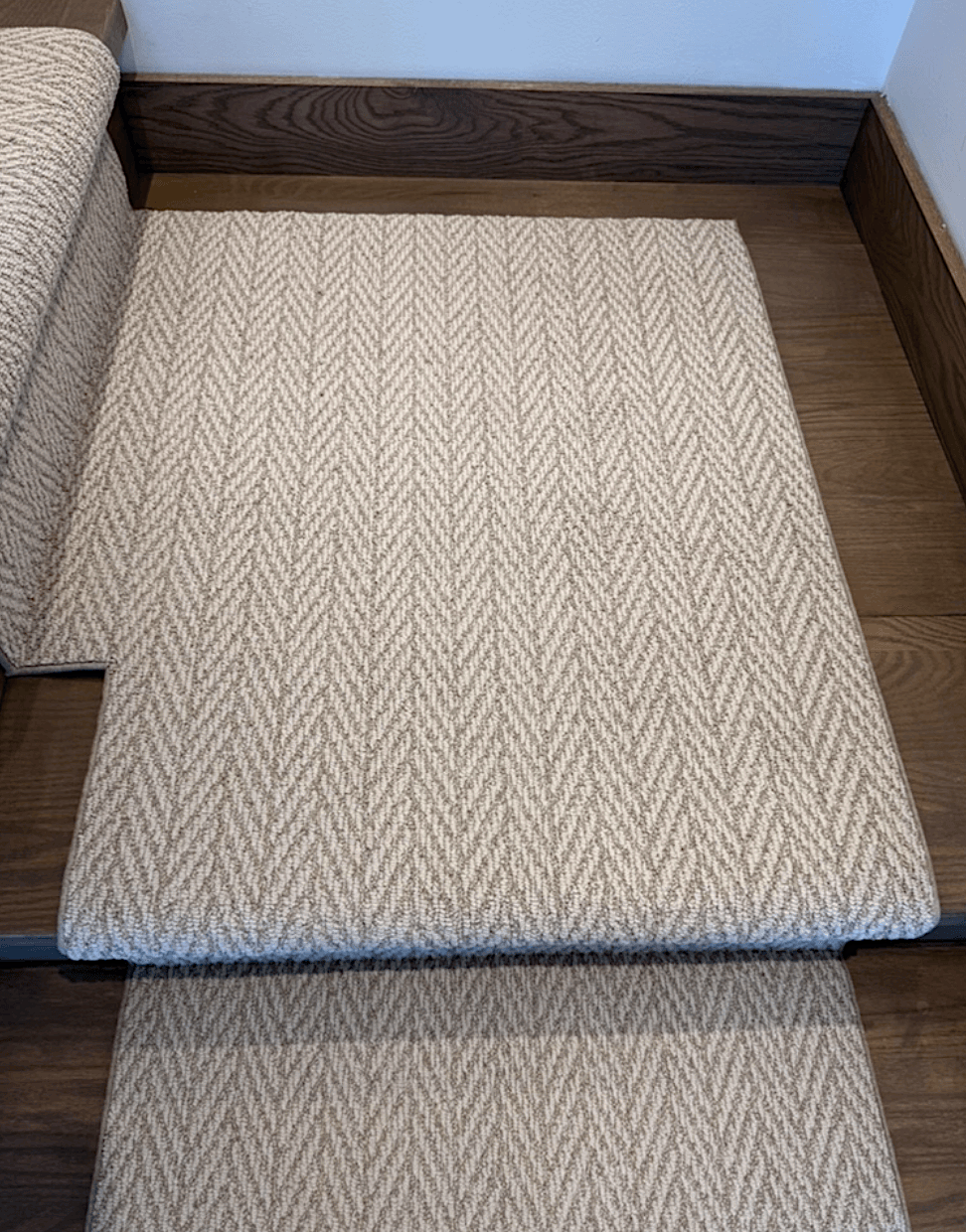 top view of left turn stair runner landing in a Modern herringbone pattern
