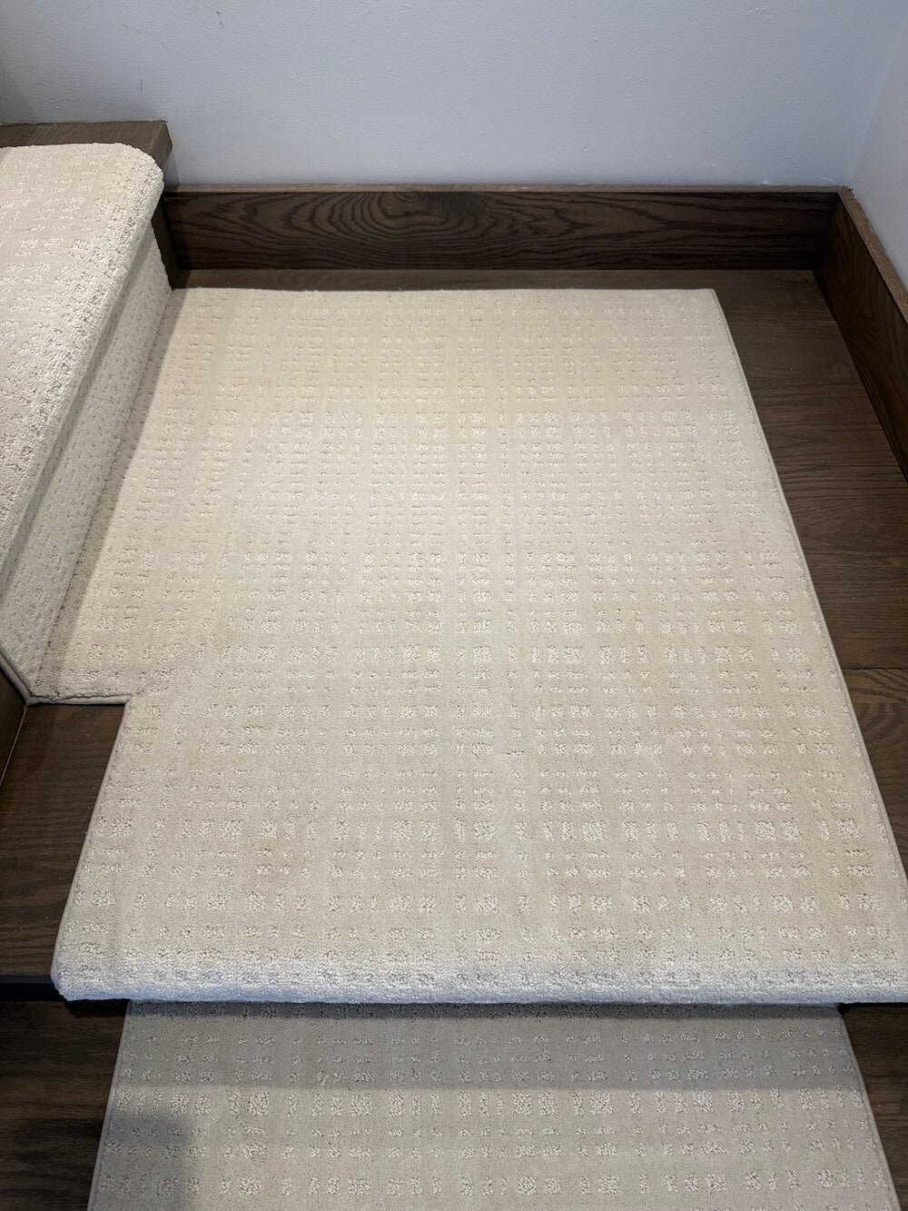 stair runner landing carpet on dark walnut wood stairs