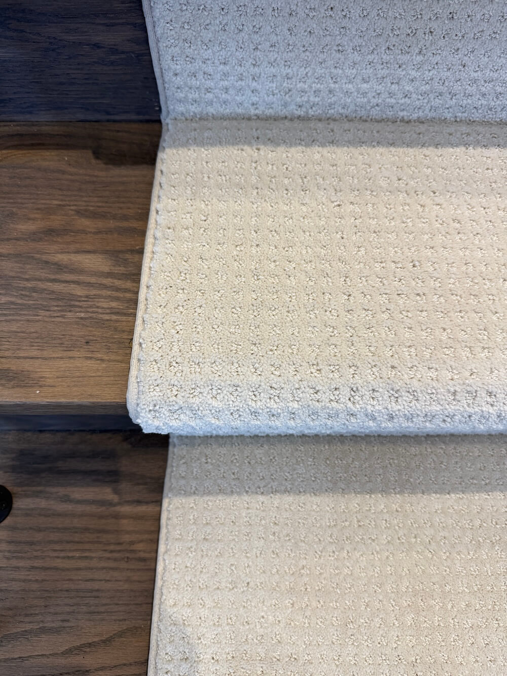 top view stair runner on dark walnut staircase