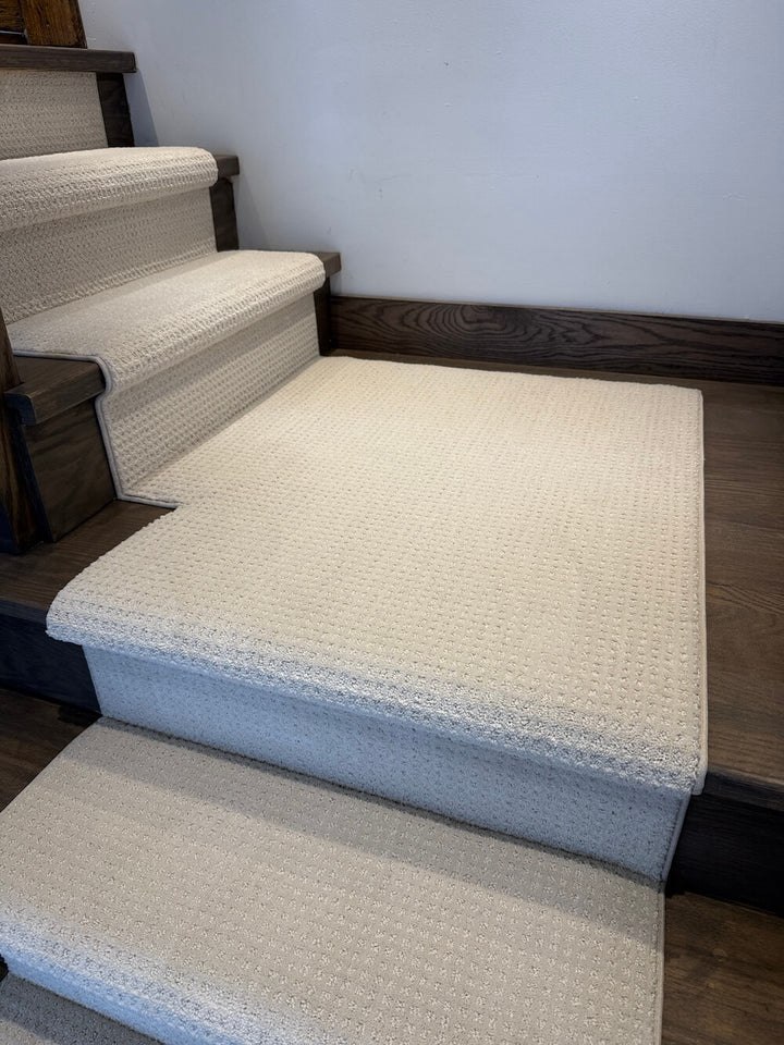 stair runner with turning landing on dark walnut stairs