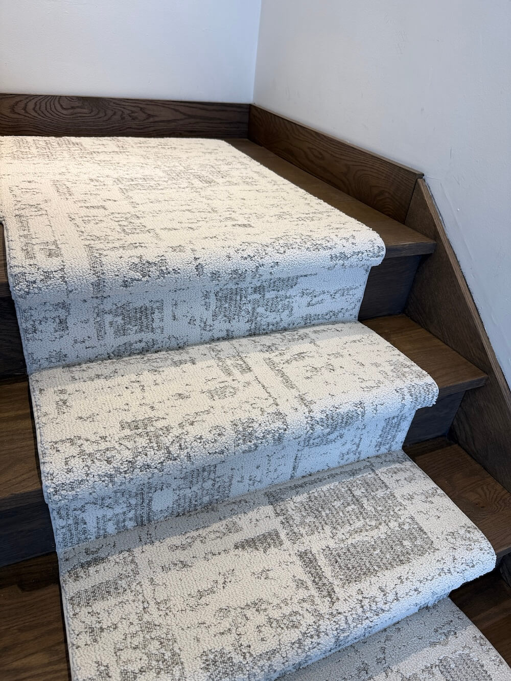 Anderson Tuftex Discover First Frost luxury stair runner installed on a wooden staircase