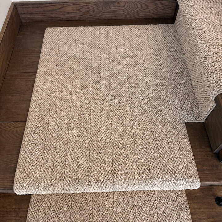 Beige berber stair runner on a wooden stairs