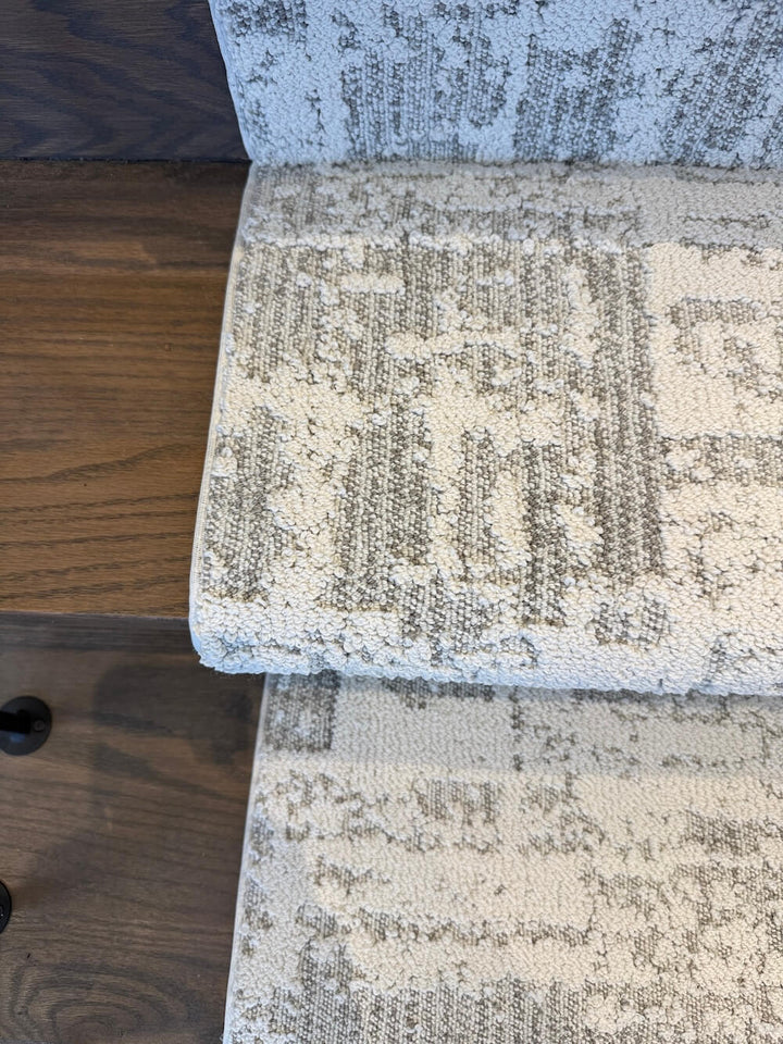 Close-up of the Discover First Frost stair runner showing its cream and gray distressed pattern