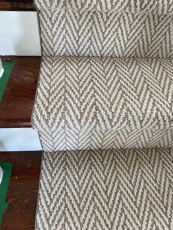 Beige and brown stair runners